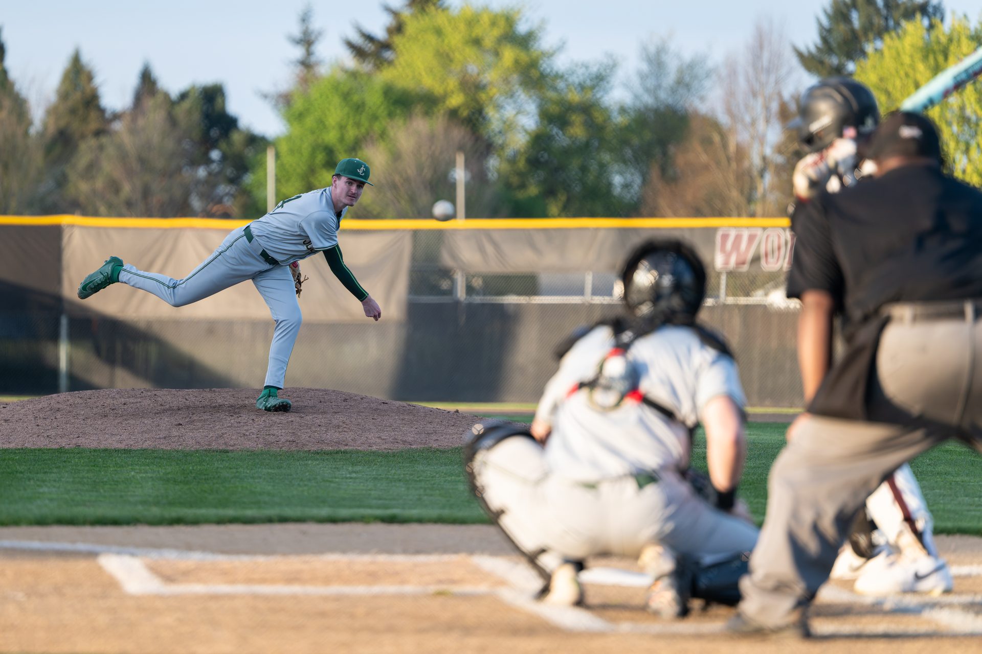 Pitcher mid follow-through on the mound, directed action stills session, Portland Oregon.