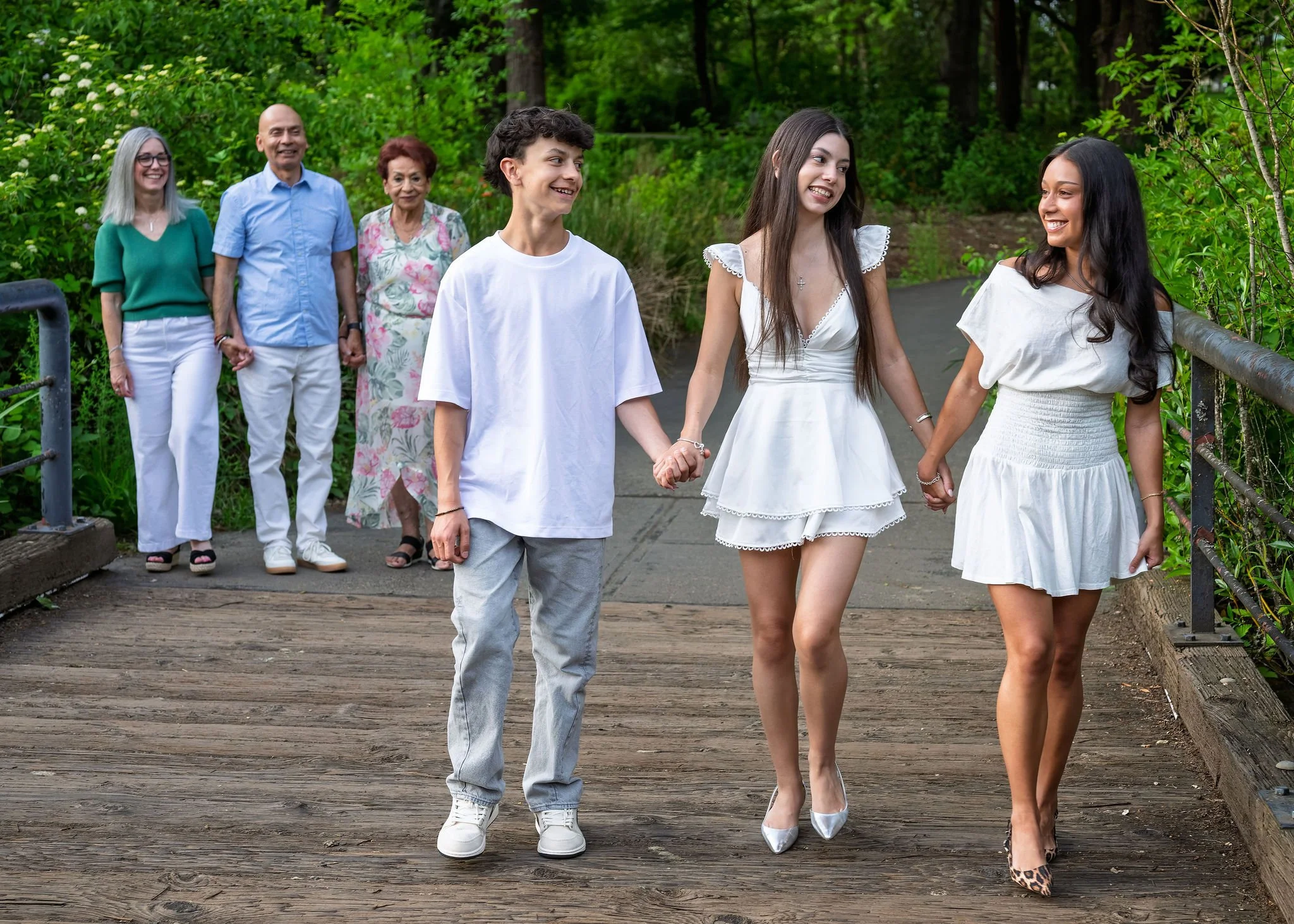 Kids laughing mid-tickle-fight during a family session